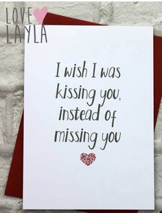 a card that says i wish i was kissing you instead of missing you on it