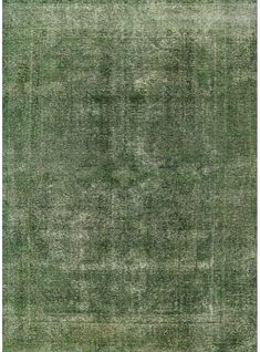 an old green rug with faded edges