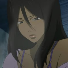 a woman with long black hair and blue eyes