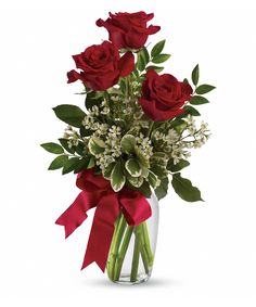 a vase filled with red roses and baby's breath in front of a happy birthday card