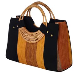 If you love elegant and classy handbags and love making a statement then this bag is for you! With sturdy and gorgeous cane handles and a stunning combination of colors from the Fugu fabric, the bag is practically royalty. The Fugu or Smock fabric is a luxury native fabric worn mostly by the royals of the Northern Tribes of Ghana. This bag also comes with an inner pocket with a zip fastening and provides lots of space, it's even big enough for a small laptop! As if that was not awesome enough, w Handheld Woven Satchel For Shopping, Elegant Market Bags With Braided Handles, Daily Use Crochet Tote Bag With Bamboo Handle, Chic Bamboo Handle Bag For Market, Chic Bags With Bamboo Handle For Market, Chic Market Bags With Bamboo Handle, Everyday Use Rectangular Crochet Bag With Bamboo Handle, Black Shoulder Bag With Bamboo Handle For Travel, Black Travel Shoulder Bag With Bamboo Handle