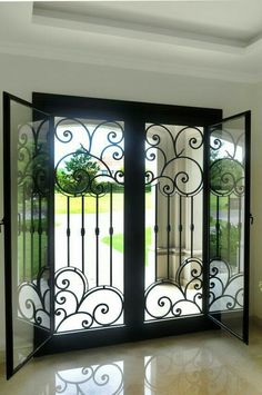 an open door in the middle of a room with white walls and marble flooring