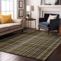 a living room filled with furniture and a fire place next to a window on top of a hard wood floor