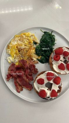 a white plate topped with eggs, bacon and spinach next to other food items