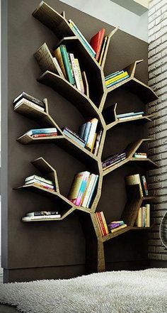 a tree shaped book shelf with books on it