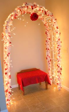 an arch decorated with flowers and lights for a wedding or special occasion to someone's family