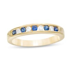 Seal your vows with this unique gemstone and diamond wedding band. Crafted in 14K gold, this interesting style showcases channel-set bright blue sapphires alternating with shimmering diamonds. Captivating with 1/8 ct. t.w. of diamonds and a brilliant buffed luster, this wedding band is the start of something beautiful. Lab-created Sapphire Ring With Channel Set For Anniversary, Sapphire Anniversary Ring, Yellow Gold Anniversary Rings, Sapphire And Diamond Band, Stacked Wedding Bands, Sapphire Wedding Band, Ring Inspiration, Sapphire Rings, Blue Sapphire Diamond