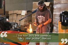 a man working on an orange motorcycle in a garage