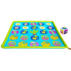 a blue and green play mat with various toys on it, including two dices