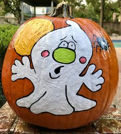 a painted pumpkin with a ghost on it