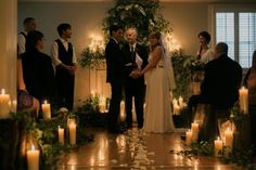 a couple getting married in front of candles