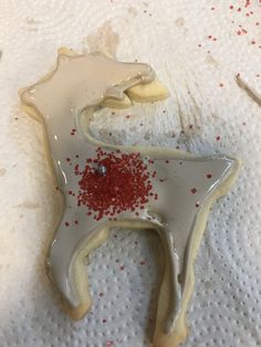 a cookie shaped like a horse with sprinkles on it's back