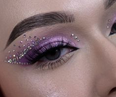 Rhinestone Concert Makeup, Purple Graphic Liner Looks, Lavender Eye Makeup Looks, Lavender Rave Makeup, Rhinestone Makeup Euphoria, Sequence Eye Makeup, Purple And Sliver Makeup, Quince Makeup Purple And Silver, Royal Purple Makeup