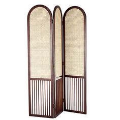 Maximize your space with this Dark Wood & Rattan Arched Trifold Room Divider! This practical divider features stylish details for a functional yet chic addition to your home. Room divider measures 48.5W x 0.9D x 67H in. Crafted of wood Dark brown finish Features natural rattan insets Trifold design Arched panels Slatted wood base Weight: 11.2 lbs. No assembly required Care: Wipe with a soft, dry cloth. This item is available at Kirklands.com only, not available in stores. Please note: this item cannot be shipped to APO/FPO addresses. | Dark Wood & Rattan Arched Trifold Room Divider, Brown, 48.5W x 0.9D 67H , Wood/Rattan | Kirkland's Home Room Divider Seating Chart Wedding, Room Divider Vintage, Window Room Divider, Duplex Decor, Broom Cupboard, Panel Partition, Partition Divider, Privacy Screens Indoor, Dc Living