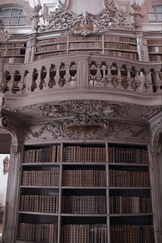 an ornate bookcase with many books in it