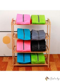 four bags are stacked on top of each other in front of a wall mounted shelf