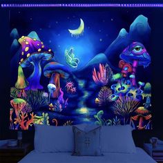 a bedroom with a large mural on the wall and a bed in front of it