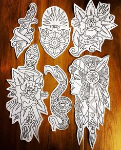 some paper cut outs sitting on top of a wooden table