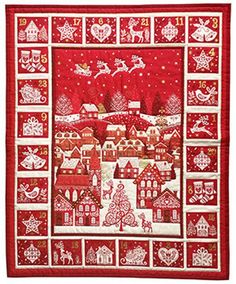 a red and white quilted christmas scene with santa's sleighs