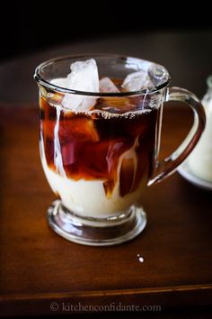 a glass mug filled with liquid and ice