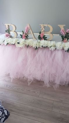 the table is decorated with pink and white flowers