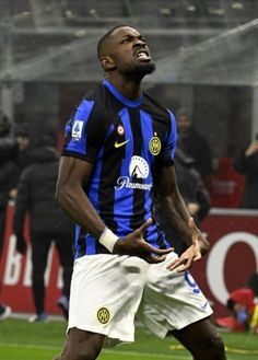 a man standing on top of a soccer field