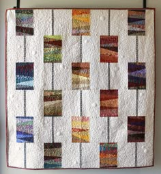 a quilt hanging on the wall