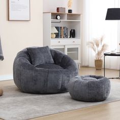 a living room with two bean bags on the floor and a chair next to it