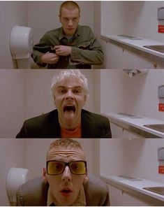 two men in the bathroom with their mouths open and one man wearing glasses making a funny face