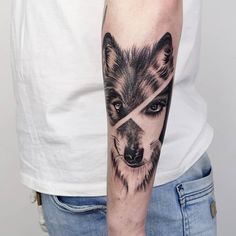 a man with a wolf tattoo on his arm