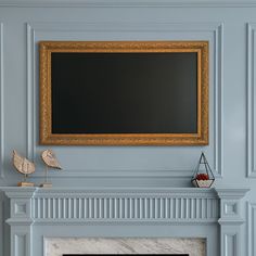 a fireplace with a painting on the mantle