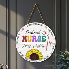 a wooden sign hanging from the side of a door that says school nurse, mrs awhile