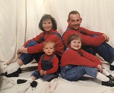 the family is posing for a photo together