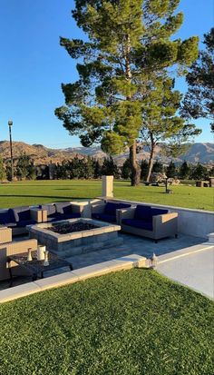 an outdoor seating area in the middle of a park