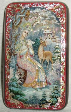 a decorative plate with a woman and deer in the snow, on a white background