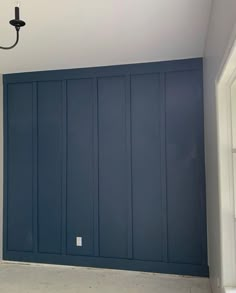 Follow for our rental transformations on Instagram @daytripperairbnb Blue Note Benjamin Moore Accent Walls, Vandusen Blue Benjamin Moore, Wescott Navy Benjamin Moore Exterior, Newbury Port Blue Benjamin Moore, Bm Britannia Blue, Newberry Port Blue Benjamin Moore, Bm Newburyport Blue, Navy Blue Board And Batten Wall, Navy Blue Shiplap Wall