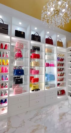 a room filled with lots of different types of purses