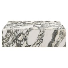 a white and black marble box on a white background