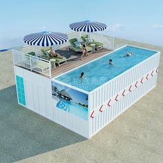 an image of people swimming in the pool on top of a shipping container that is built into the sand