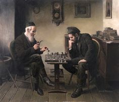 two men sitting at a table playing chess