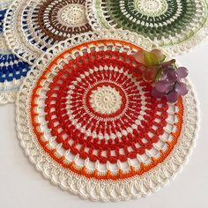 four crocheted doily with grapes on the side