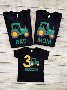 two matching shirts with the number 3 and tractor on them, one is for a child's 3rd birthday