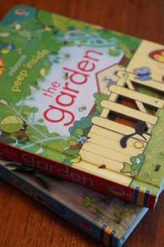 two children's books are stacked on top of each other, one is green and the other is yellow