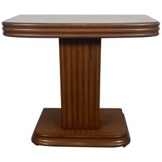 a wooden table with a glass top and pedestal on the bottom, against a white background