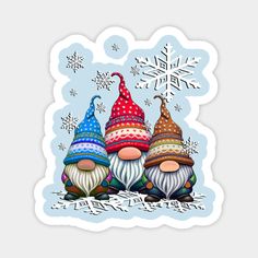 three gnomes with hats and snowflakes on their heads are sitting next to each other