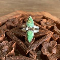 This completely handmade ring features two vibrant sonoran lime turquoise stones.  They are set on a split band and independent of each other.  The ring will best fit a 7.5-7.75 and is finished with a soft patina and a satin finish.  Please make sure to know your accurate size.  I am happy to answer any questions and am here to help. Thank you for viewing my jewelry.  Each piece is made with my hands and heart! Teardrop Ring, Turquoise Stones, Instagram Inspo, Ring Size 7, Turquoise Stone, Rings Statement, Satin Finish, Handmade Ring