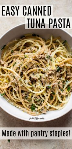 a white bowl filled with pasta and sauce