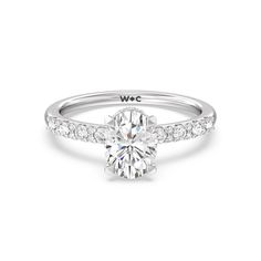 a white gold engagement ring with diamonds on the side