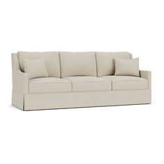 an image of a couch with pillows on the top and bottom part, in beige