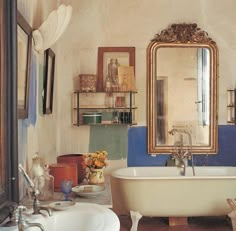 an old fashioned bathtub and sink in a bathroom